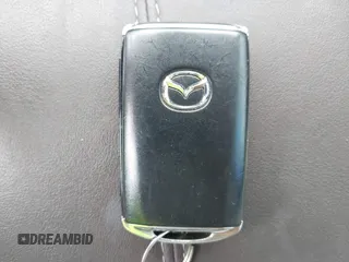 2021 Mazda CX-30 Premium z VIN 3MVDMBDL7MM236474, wystawiony jako IAAI lot #42284515 z przebiegiem 58 565 mil mil oraz . Historia ofert i sprzedaży dostępna na DreamBid. Obrazek 11.