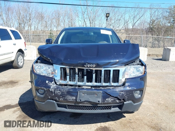 2011 Jeep Grand Cherokee Laredo with VIN 1J4RR4GG3BC670712, listed as a IAAI auction lot 41738127 with 93,714 mi miles and . Bid and sale history available at DreamBid. Image 6.
