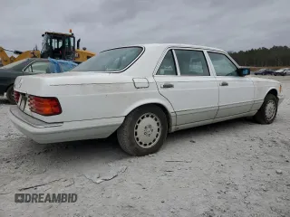 1989 Mercedes-Benz 560 with VIN WDBCA39E0KA469417, listed as a Copart auction lot 43929215 with 52,559 mi miles and Salvage Title. Bid and sale history available at DreamBid. Image 3.