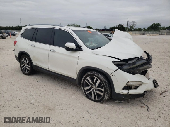 2017 Honda Pilot Touring with VIN 5FNYF5H95HB015365, listed as a Copart auction lot 52371205 with 153,141 mi miles and Salvage title. Bid and sale history available at DreamBid. Image 4.