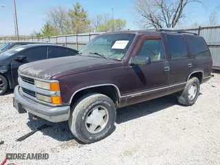 1997 Chevrolet Tahoe with VIN 1GNEK13R5VJ386701, listed as a IAAI auction lot 42046195 with 241,735 mi miles. Bid and sale history available at carsss.com. Image 2.