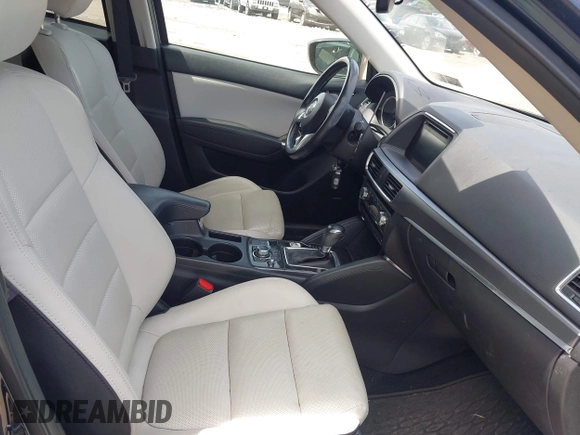 2016 Mazda CX-5 Grand Touring z VIN JM3KE4DY1G0817562, wystawiony jako IAAI lot #42289929 z przebiegiem 135 476 mil mil oraz . Historia ofert i sprzedaży dostępna na DreamBid. Obrazek 5.