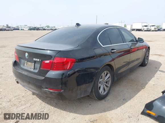 2015 BMW 5 Series 528i with VIN WBA5A5C58FD520694, listed as a IAAI auction lot 41804906 with 121,636 mi miles. Bid and sale history available at carsss.com. Image 4.