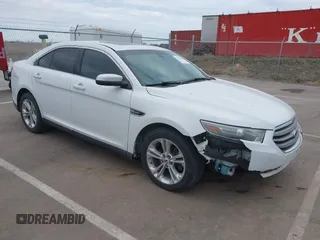 2013 Ford Taurus SEL z VIN 1FAHP2H84DG215470, wystawiony jako IAAI lot #41861786 z przebiegiem 157 433 mil mil oraz . Historia ofert i sprzedaży dostępna na DreamBid. Obrazek 1.