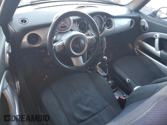 2007 MINI Convertible with VIN WMWRF33537TG17447, listed as a Copart auction lot 59015995 with 137,032 mi miles and Salvage title. Bid and sale history available at DreamBid. Image 8.