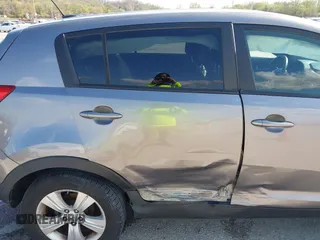 2013 Kia Sportage LX with VIN KNDPB3A24D7365157, listed as a IAAI auction lot 41968652 with 137,055 mi miles and . Bid and sale history available at DreamBid. Image 6.