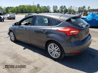 2016 Ford Focus Titanium with VIN 1FADP3N27GL201482, listed as a Copart auction lot 51768335 with 54,463 mi miles and Salvage title. Bid and sale history available at DreamBid. Image 2.