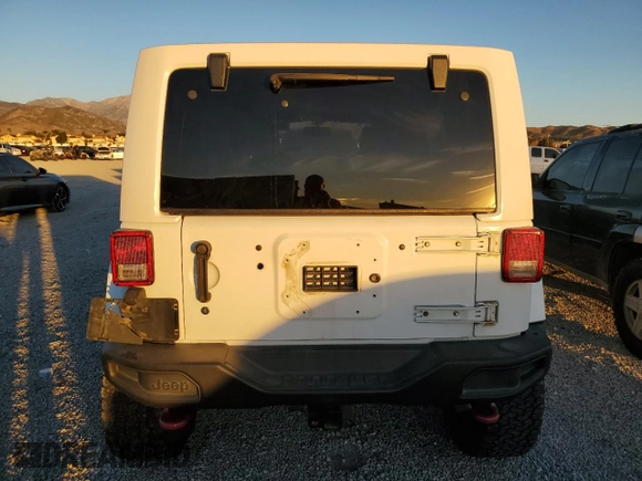 2015 Jeep Wrangler Unlimited Rubicon with VIN 1C4BJWFG5FL659017, listed as a Copart auction lot 84435034 with 69,915 mi miles and Salvage Title. Bid and sale history available at carsss.com. Image 6.
