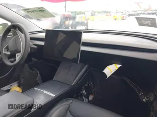 2024 Tesla Model 3 with VIN 5YJ3E1EA6RF751009, listed as a IAAI auction lot 40537919 with Not Provided miles and . Bid and sale history available at DreamBid. Image 5.