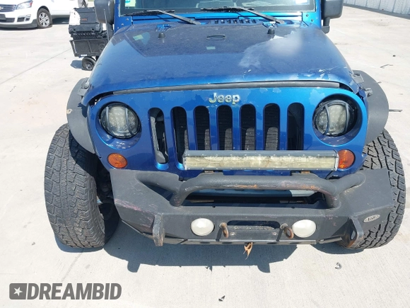 2010 Jeep Wrangler Sport with VIN 1J4AA2D11AL117404, listed as a IAAI auction lot 42012340 with 266,310 mi miles and . Bid and sale history available at carsss.com. Image 12.