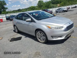2015 Ford Focus Titanium with VIN 1FADP3J27FL267339, listed as a Copart auction lot 63395835 with 73,372 mi miles and Salvage title. Bid and sale history available at DreamBid. Image 4.