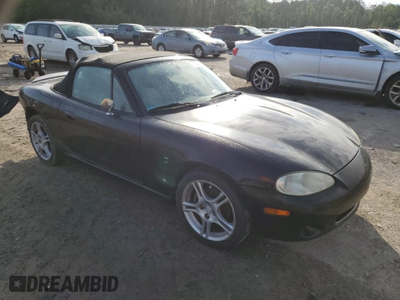 2004 Mazda MX-5 Miata LS with VIN JM1NB353140408906, listed as a Copart auction lot 56664715 with 86,603 mi miles and Salvage title. Bid and sale history available at DreamBid. Image 4.