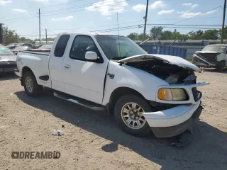 2002 Ford F-150 XL with VIN 1FTRX07W52KB08618, listed as a Copart auction lot 57941974 with 172,843 mi miles and Salvage title. Bid and sale history available at DreamBid. Image 4.