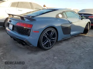 2022 Audi R8 z VIN WUAKBAFX5N7901301, wystawiony jako Copart lot #76451354 z przebiegiem Nie podano mil oraz Nie do naprawy • Non repairable. Historia ofert i sprzedaży dostępna na DreamBid. Obrazek 3.