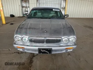2000 Jaguar XJ with VIN SAJDA25B8YMF04079, listed as a Copart auction lot 50592595 with 131,647 mi miles and Salvage title. Bid and sale history available at DreamBid. Image 5.