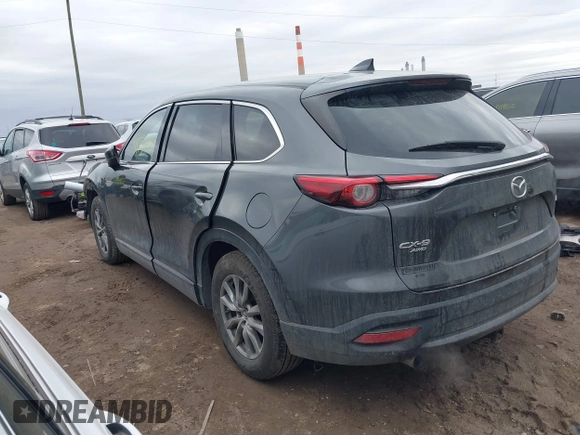 2018 Mazda CX-9 Touring with VIN JM3TCBCY3J0212479, listed as a IAAI auction lot 41737024 with 128,552 mi miles and . Bid and sale history available at DreamBid. Image 3.