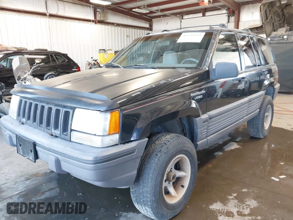 1995 Jeep Grand Cherokee Laredo z VIN 1J4GZ58Y3SC670696, wystawiony jako IAAI lot #42530934 z przebiegiem 165 658 mil mil oraz . Historia ofert i sprzedaży dostępna na DreamBid. Obrazek 17.