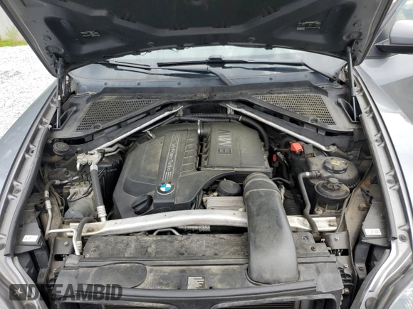 2012 BMW X5 35i with VIN 5UXZV4C50CL991452, listed as a Copart auction lot 56890265 with 147,019 mi miles and Salvage title. Bid and sale history available at DreamBid. Image 12.