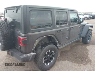 2024 Jeep Wrangler Rubicon z VIN 1C4RJXR67RW276710, wystawiony jako IAAI lot #42047318 z przebiegiem 35 857 mil mil oraz . Historia ofert i sprzedaży dostępna na DreamBid. Obrazek 4.