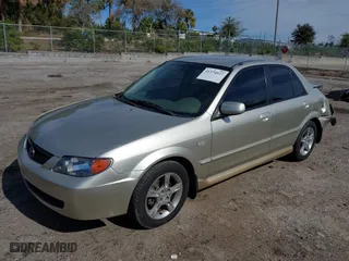 2003 Mazda Protege DX with VIN JM1BJ225731212628, listed as a IAAI auction lot 41374927 with 105,662 mi miles. Bid and sale history available at carsss.com. Image 18.