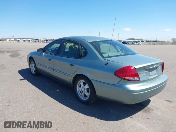 2005 Ford Taurus SE with VIN 1FAFP53U05A273576, listed as a IAAI auction lot 42140404 with 58,735 mi miles. Bid and sale history available at carsss.com. Image 3.
