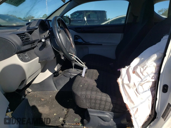 2012 Scion iQ with VIN JTNJJXB00CJ020346, listed as a Copart auction lot 80783494 with 142,577 mi miles and Salvage Title. Bid and sale history available at carsss.com. Image 7.