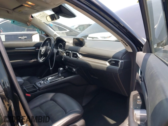 2017 Mazda CX-5 Touring with VIN JM3KFACL0H0124632, listed as a IAAI auction lot 42134971 with 107,029 mi miles and . Bid and sale history available at carsss.com. Image 5.