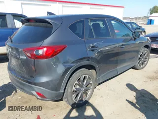 2016 Mazda CX-5 Grand Touring with VIN JM3KE4DY8G0823567, listed as a IAAI auction lot 41784384 with 143,836 mi miles and . Bid and sale history available at carsss.com. Image 4.