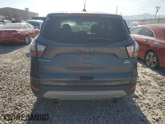 2017 Ford Escape SE z VIN 1FMCU0GD3HUF08778, wystawiony jako Copart lot #58224765 z przebiegiem 67 211 mil mil oraz Szkoda całkowita • Salvage title. Historia ofert i sprzedaży dostępna na DreamBid. Obrazek 6.