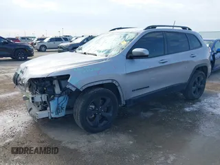 2021 Jeep Cherokee Altitude with VIN 1C4PJLLB6MD112830, listed as a IAAI auction lot 41560135 with 76,760 mi miles. Bid and sale history available at carsss.com. Image 2.