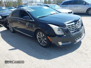 2013 Cadillac XTS Luxury z VIN 2G61P5S3XD9220510, wystawiony jako IAAI lot #41977046 z przebiegiem 236 009 mil mil oraz . Historia ofert i sprzedaży dostępna na DreamBid. Obrazek 1.