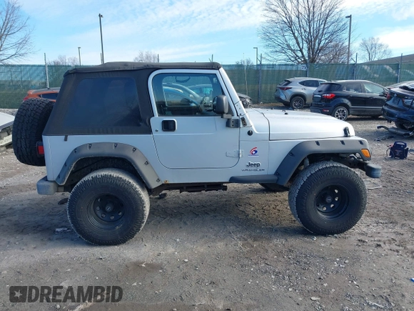 2003 Jeep Wrangler X with VIN 1J4FA39S33P363153, listed as a IAAI auction lot 41584805 with 160,676 mi miles. Bid and sale history available at carsss.com. Image 14.