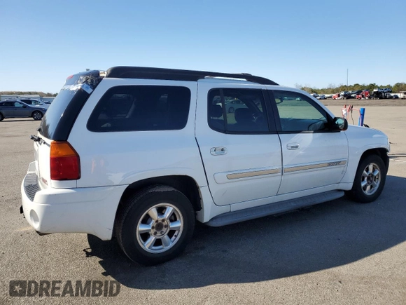 2003 GMC Envoy SLT z VIN 1GKET16S736179347, wystawiony jako Copart lot #52370775 z przebiegiem 230 623 mil mil oraz Szkoda całkowita • Salvage title. Historia ofert i sprzedaży dostępna na DreamBid. Obrazek 3.