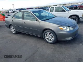 2003 Toyota Camry LE with VIN JTDBE32K130149032, listed as a IAAI auction lot 42063174 with 241,424 mi miles and . Bid and sale history available at DreamBid. Image 1.