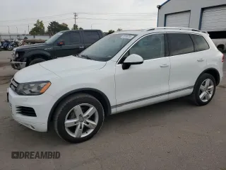 2013 Volkswagen Touareg Sport с VIN WVGEP9BP9DD003974, выставлен на аукционе Copart как лот 75106234 с пробегом 211 323 миль миль и Чистый • Clean title. История ставок и продаж доступна на DreamBid. Изображение 1.