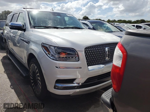 2020 Lincoln Navigator Black Label z VIN 5LMJJ3TT4LEL21595, wystawiony jako Copart lot #73951494 z przebiegiem Nie podano mil oraz Szkoda całkowita • Salvage title. Historia ofert i sprzedaży dostępna na DreamBid. Obrazek 5.
