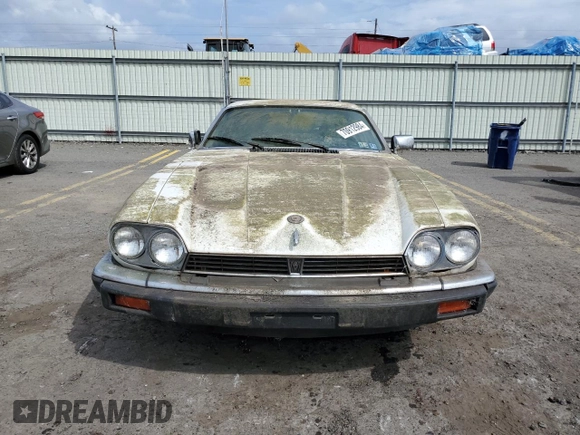 1989 Jaguar XJS z VIN SAJNY584XKC161154, wystawiony jako Copart lot #70912984 z przebiegiem 65 188 mil mil oraz Czysty tytuł • Clean title. Historia ofert i sprzedaży dostępna na DreamBid. Obrazek 5.