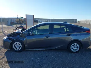 2020 Toyota Prius L Eco z VIN JTDKARFU2L3120891, wystawiony jako IAAI lot #41318597 z przebiegiem 79 848 mil mil oraz . Historia ofert i sprzedaży dostępna na DreamBid. Obrazek 14.