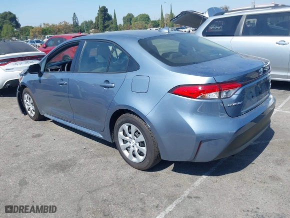 2024 Toyota Corolla Hybrid LE with VIN JTDBCMFE5RJ030239, listed as a IAAI auction lot 40489207 with 5,295 mi miles. Bid and sale history available at carsss.com. Image 3.