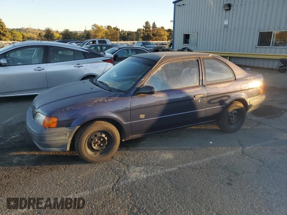 1996 Toyota Tercel DX z VIN JT2AC52L5T0190097, wystawiony jako Copart lot #76574844 z przebiegiem 175 256 mil mil oraz Tytuł czysty. Historia ofert i sprzedaży dostępna na DreamBid. Obrazek 1.