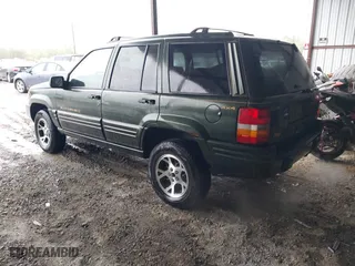 1997 Jeep Grand Cherokee Limited with VIN 1J4GZ78Y5VC723429, listed as a IAAI auction lot 42012836 with 231,126 mi miles. Bid and sale history available at carsss.com. Image 3.