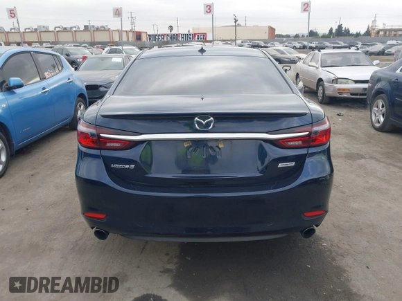 2018 Mazda 6 Grand Touring with VIN JM1GL1TY3J1334600, listed as a IAAI auction lot 41060893 with 64,852 mi miles and . Bid and sale history available at DreamBid. Image 17.