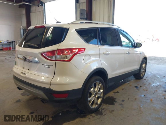 2016 Ford Escape Titanium with VIN 1FMCU9J94GUC28648, listed as a IAAI auction lot 42043761 with 82,509 mi miles and . Bid and sale history available at DreamBid. Image 4.