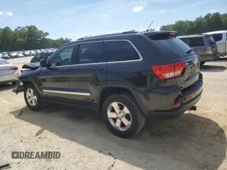2013 Jeep Grand Cherokee Laredo with VIN 1C4RJEAG2DC519570, listed as a Copart auction lot 52066225 with 129,091 mi miles and Salvage Title. Bid and sale history available at carsss.com. Image 2.