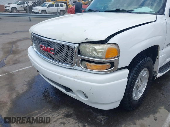 2005 GMC Yukon Denali z VIN 1GKEK63U55J259803, wystawiony jako IAAI lot #42126835 z przebiegiem 199 762 mil mil oraz . Historia ofert i sprzedaży dostępna na DreamBid. Obrazek 6.
