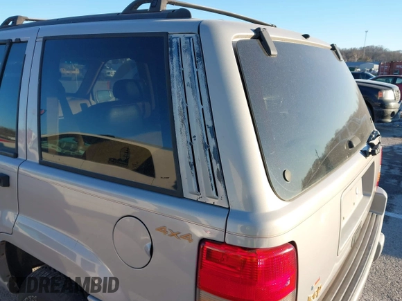 1997 Jeep Grand Cherokee Limited with VIN 1J4GZ78Y8VC718435, listed as a IAAI auction lot 41405361 with 210,599 mi miles. Bid and sale history available at carsss.com. Image 12.
