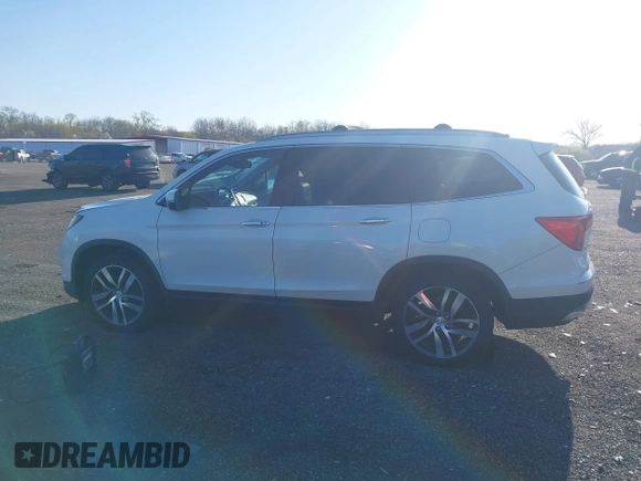 2017 Honda Pilot Elite with VIN 5FNYF6H00HB032386, listed as a IAAI auction lot 41976702 with 153,251 mi miles and . Bid and sale history available at DreamBid. Image 14.