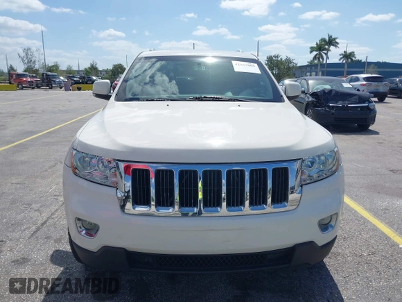 2011 Jeep Grand Cherokee Laredo with VIN 1J4RS4GG0BC573388, listed as a IAAI auction lot 42167064 with 63,363 mi miles and . Bid and sale history available at DreamBid. Image 6.