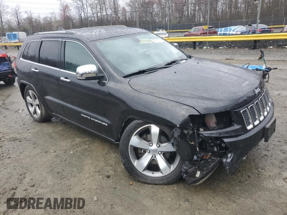 2014 Jeep Grand Cherokee Overland with VIN 1C4RJFCG1EC587458, listed as a Copart auction lot 50213015 with 124,266 mi miles and Salvage Title. Bid and sale history available at carsss.com. Image 4.