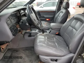 1997 Jeep Grand Cherokee Limited z VIN 1J4GZ78Y8VC586034, wystawiony jako Copart lot #58061705 z przebiegiem 244 355 mil mil oraz Czysty tytuł • Clean title. Historia ofert i sprzedaży dostępna na DreamBid. Obrazek 7.